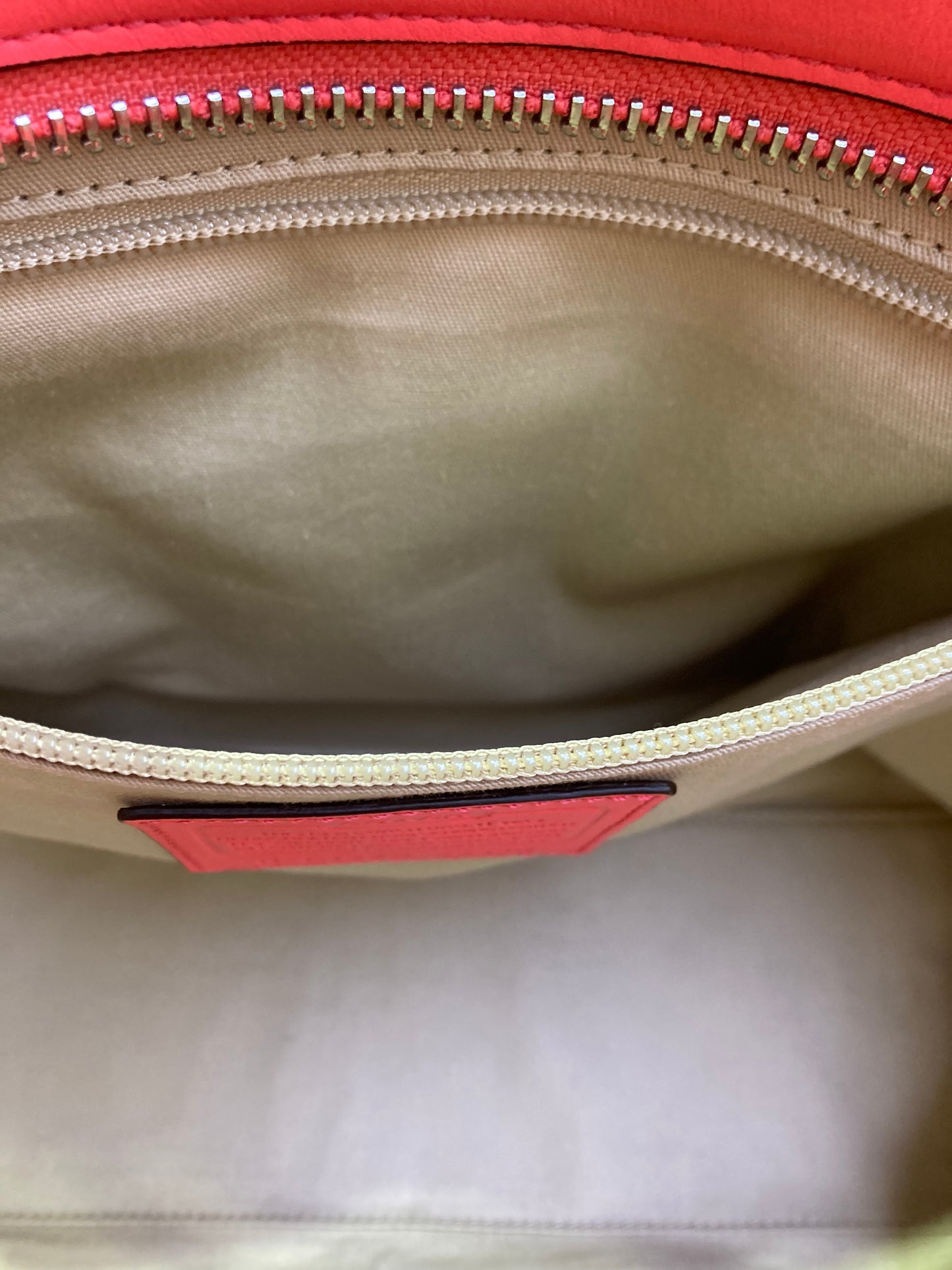 Coach Designer Handbag leather salmon color.