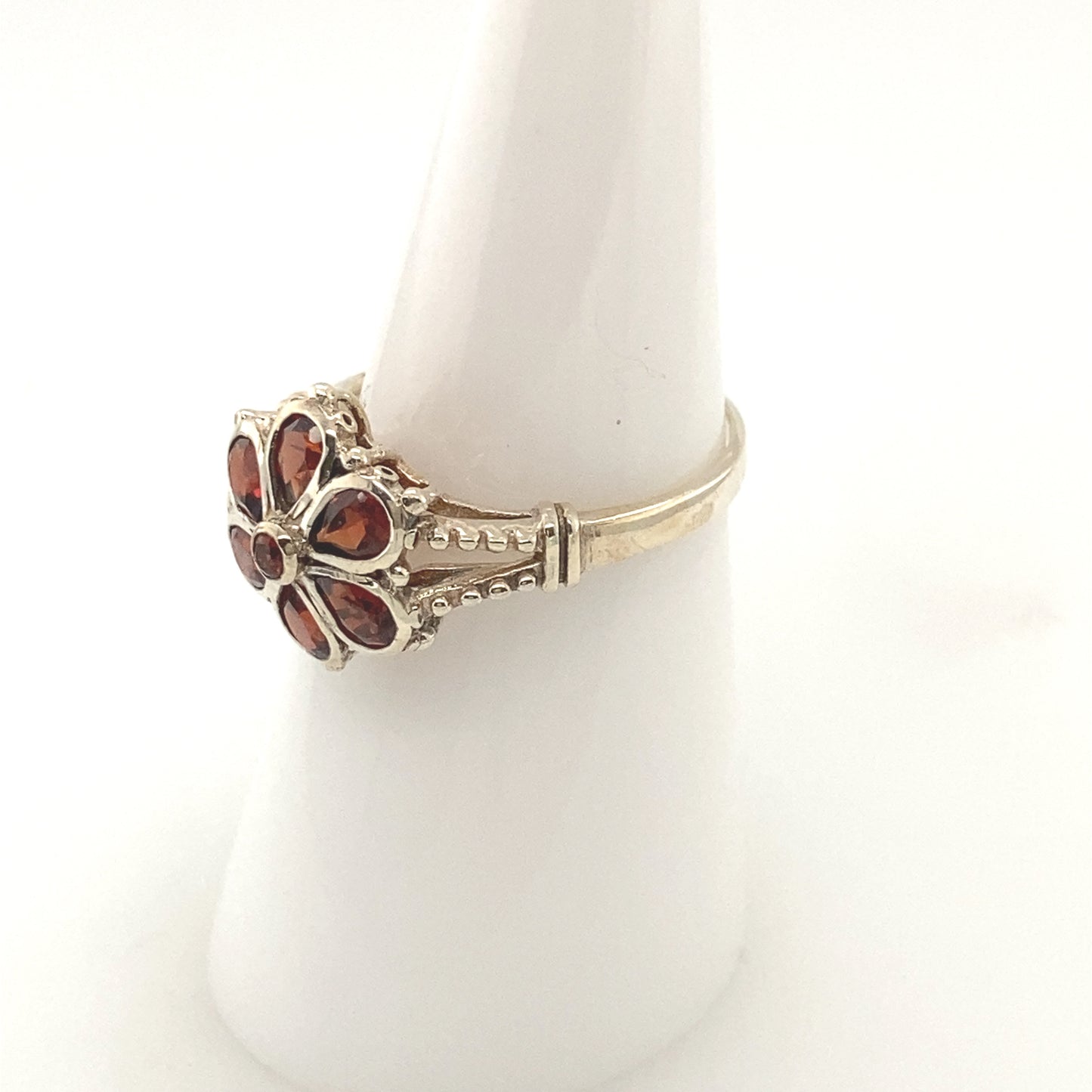 Sterling Silver 925 Rhodium plated Ring with garnet stone.
