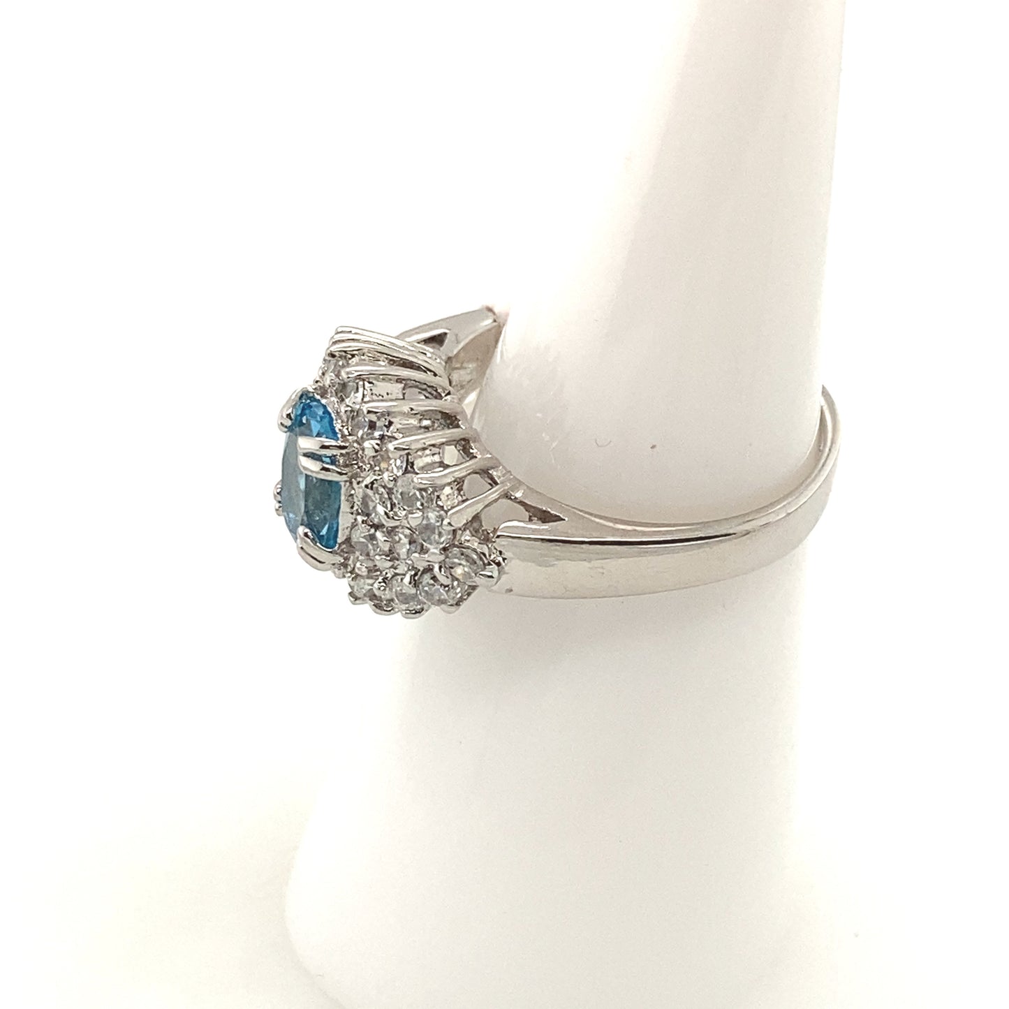 Sterling Silver 925 Rhodium plated Ring with blue topaz color crystal stone.