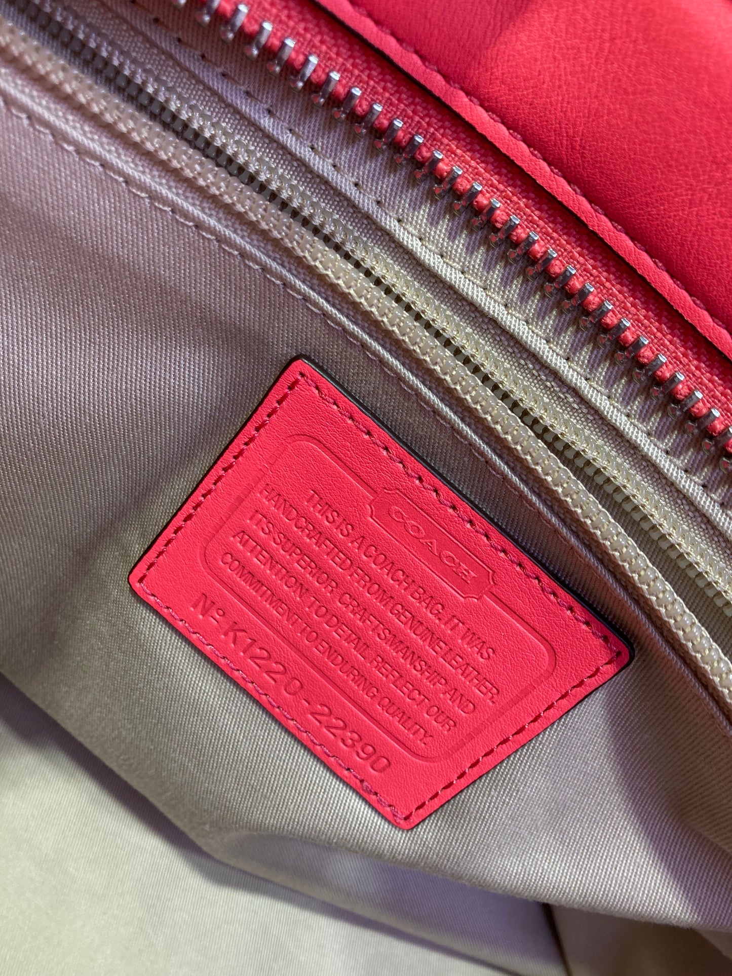 Coach Designer Handbag leather salmon color.