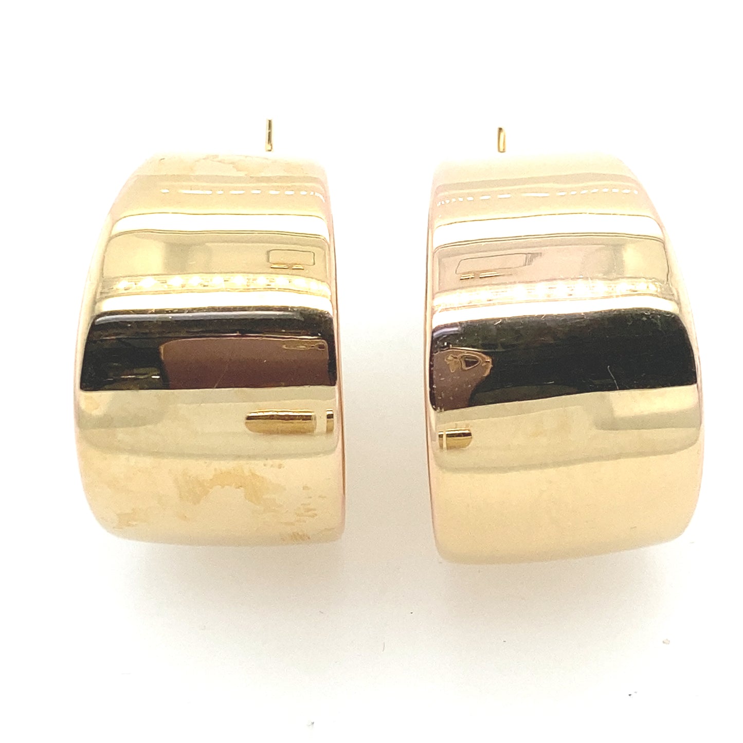 14 k yellow gold hoop earring from Italy.