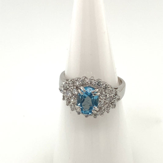 Sterling Silver 925 Rhodium plated Ring with blue topaz color crystal stone.