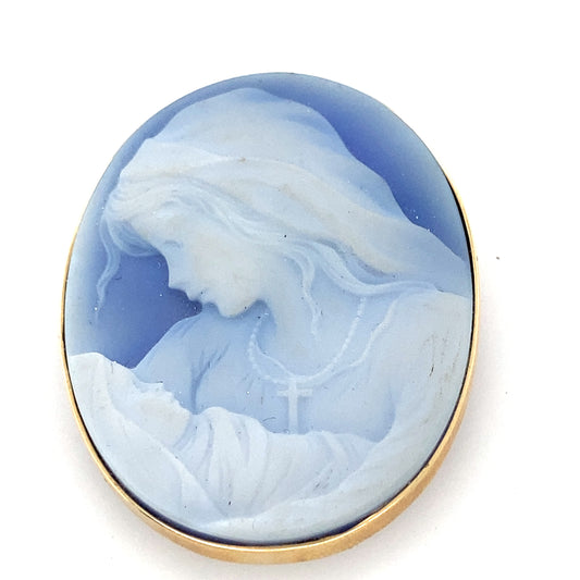 14k yellow gold frame into a beautiful blue color cameo. Gorgeous art work.