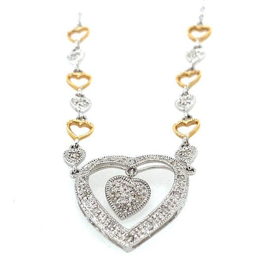 14K white and yellow gold chain with white gold heart shape. The pendant has a lots of small diamonds.