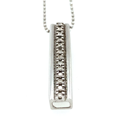 14K white gold necklace with white gold pendant and small diamonds.