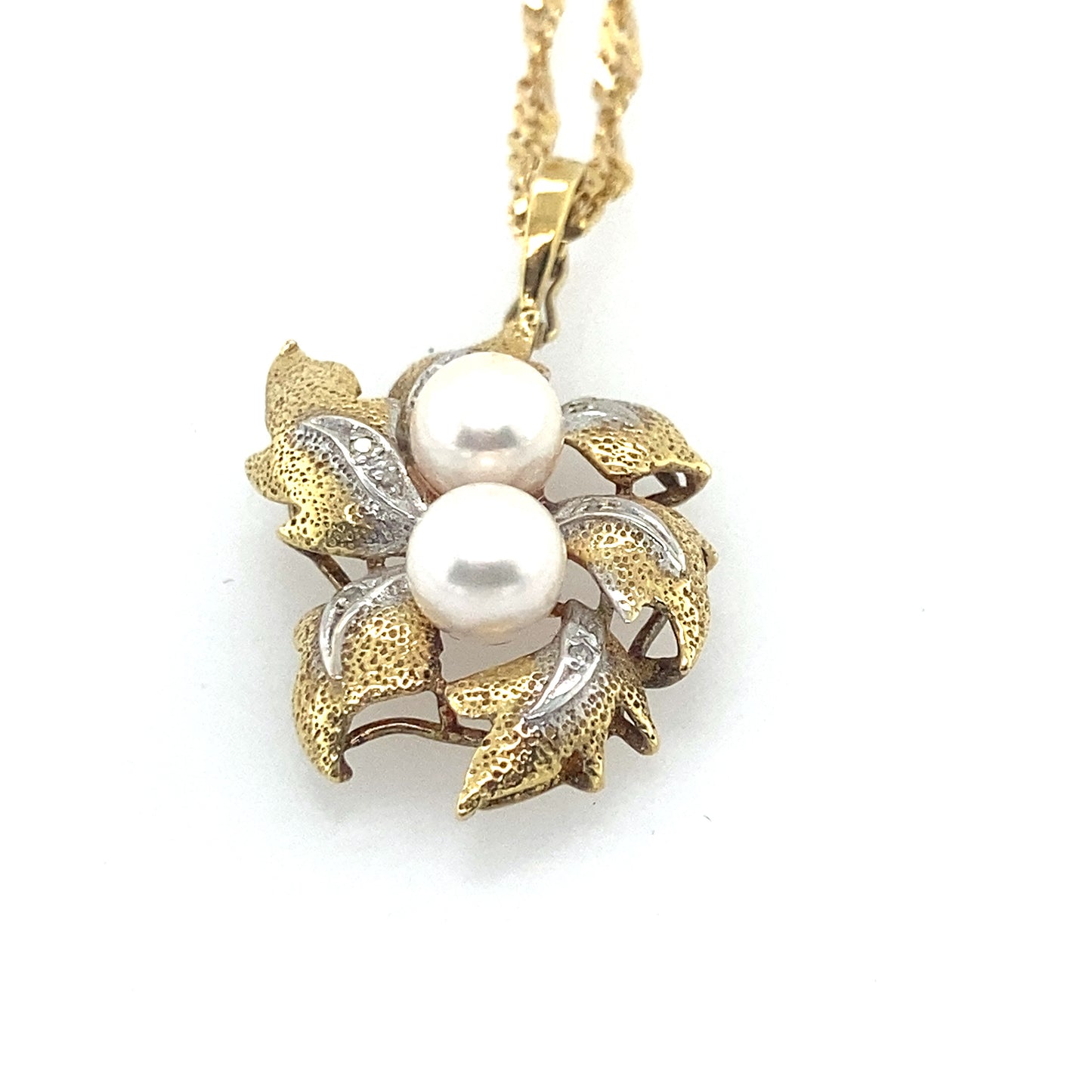 14k white gold yellow color south see pearl with small diamonds 14 mm. Chain is 14k white gold 26 inch.