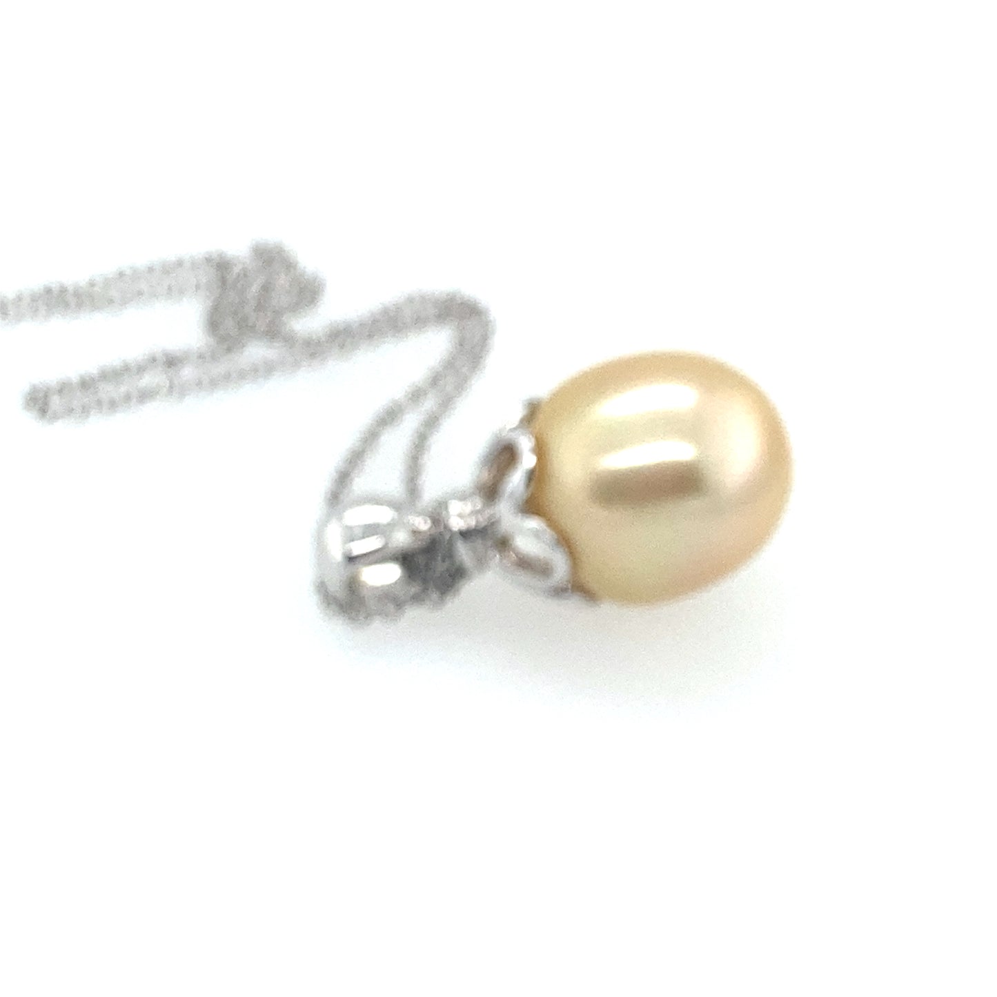 14k white gold yellow color south see pearl with small diamonds 14 mm. Chain is 14k white gold 26 inch.