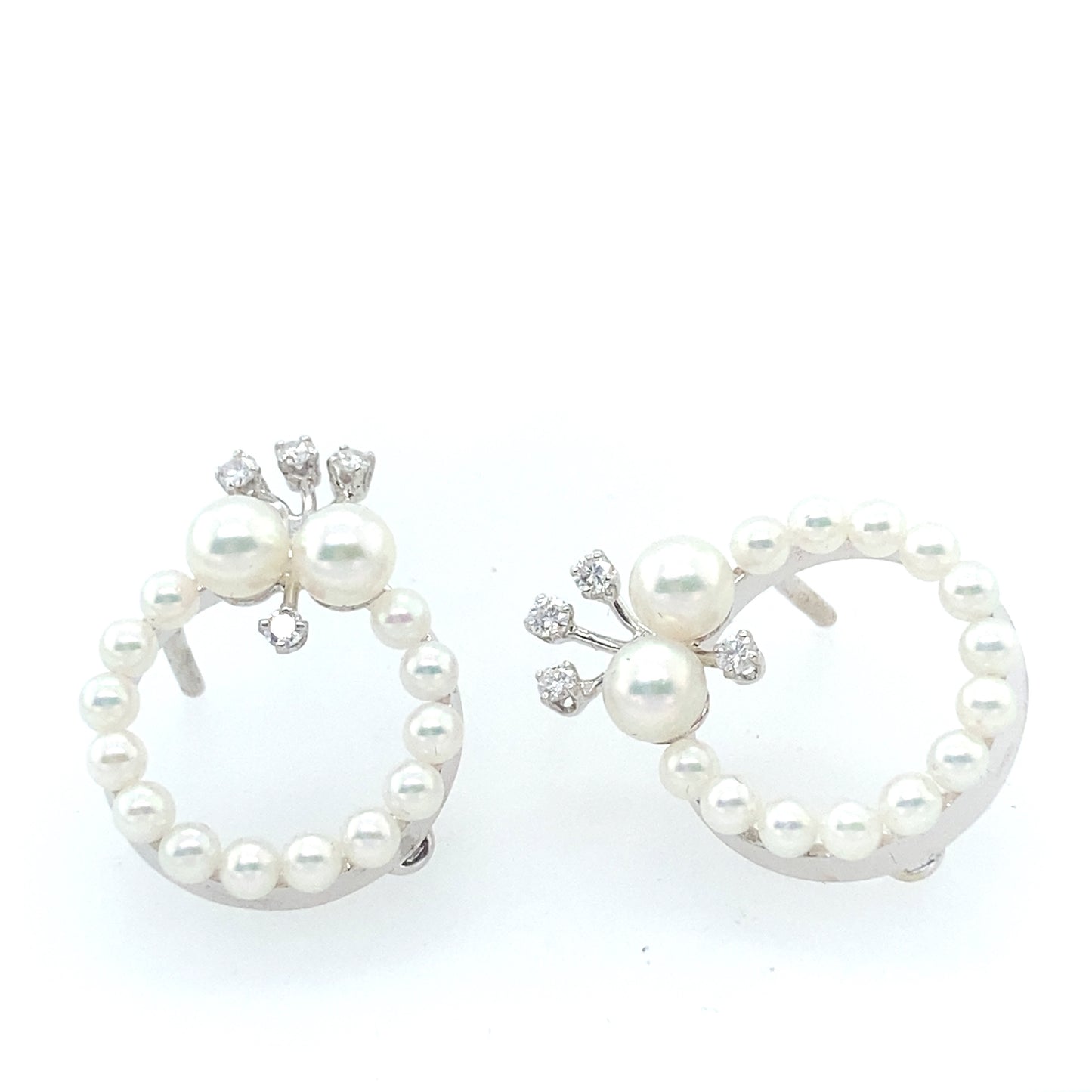 14K White Gold South See Pearl Earrings with 3 diamonds on the top.